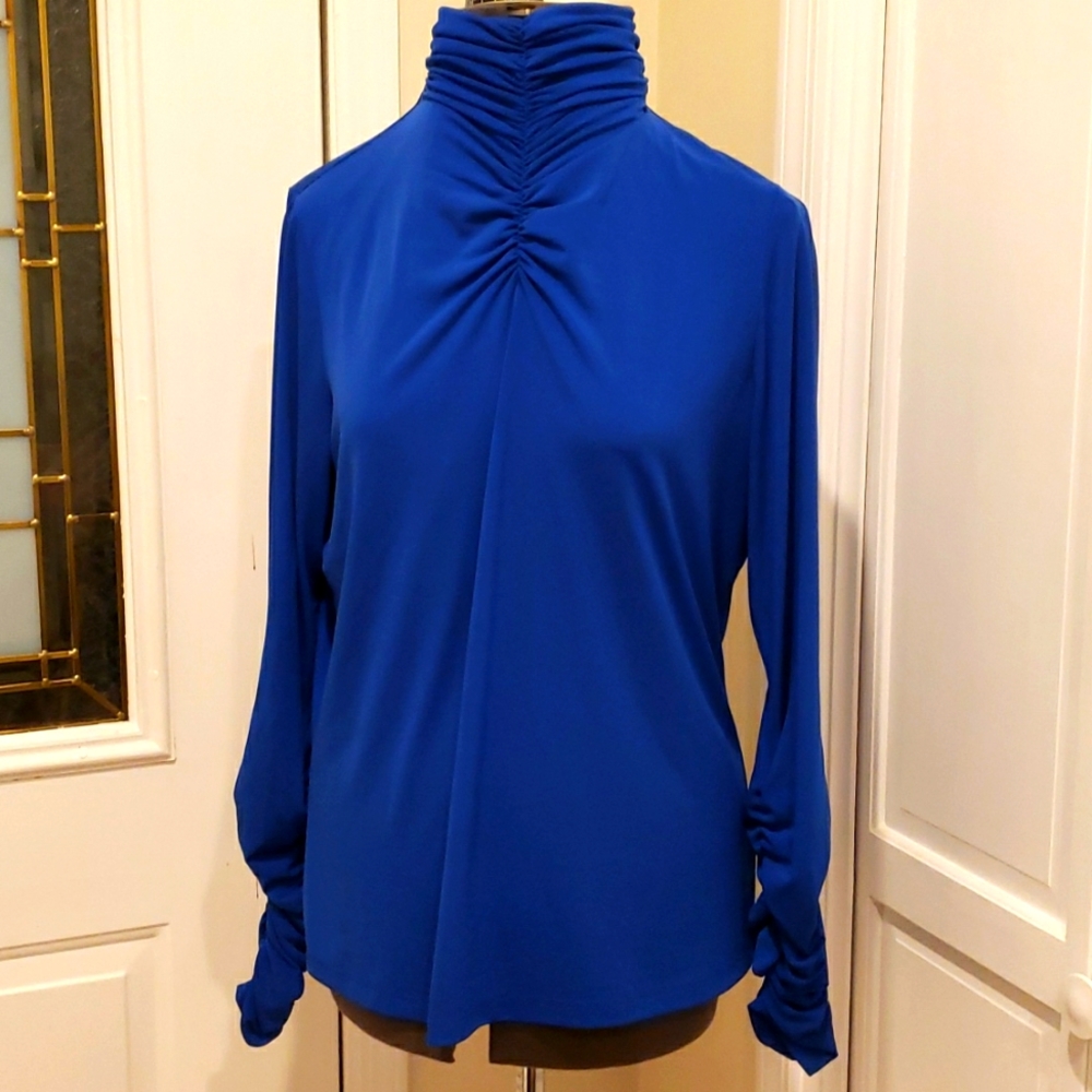 Susan Graver liquid knit top, size Medium. It is light navy blue.